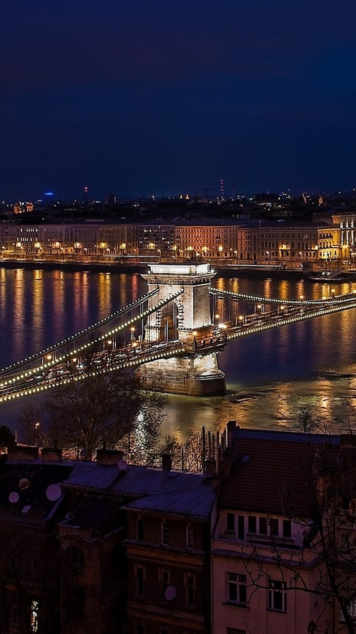Bridge Over River During Night Time. Wallpaper in 720x1280 Resolution