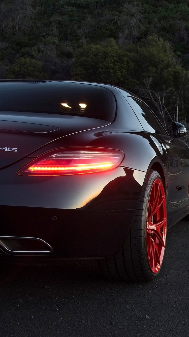 Red Ferrari Sports Car on Road During Daytime. Wallpaper in 750x1334 Resolution