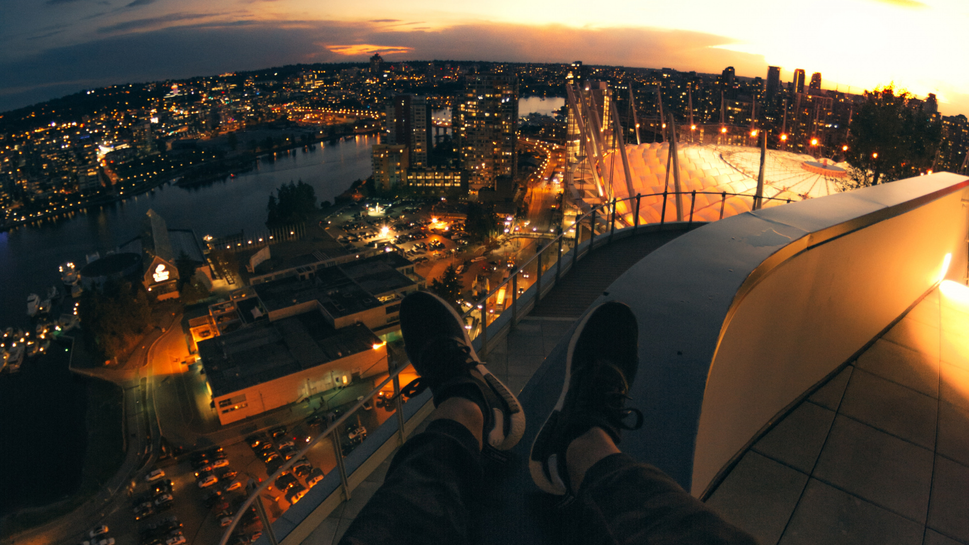 Person in Black Pants Sitting on Roof Top During Night Time. Wallpaper in 1920x1080 Resolution