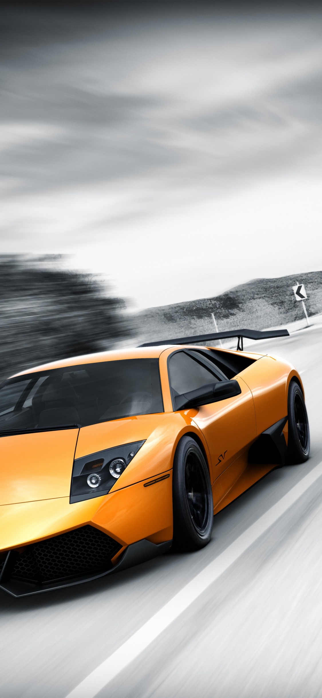 Yellow Porsche 911 on Road. Wallpaper in 1125x2436 Resolution