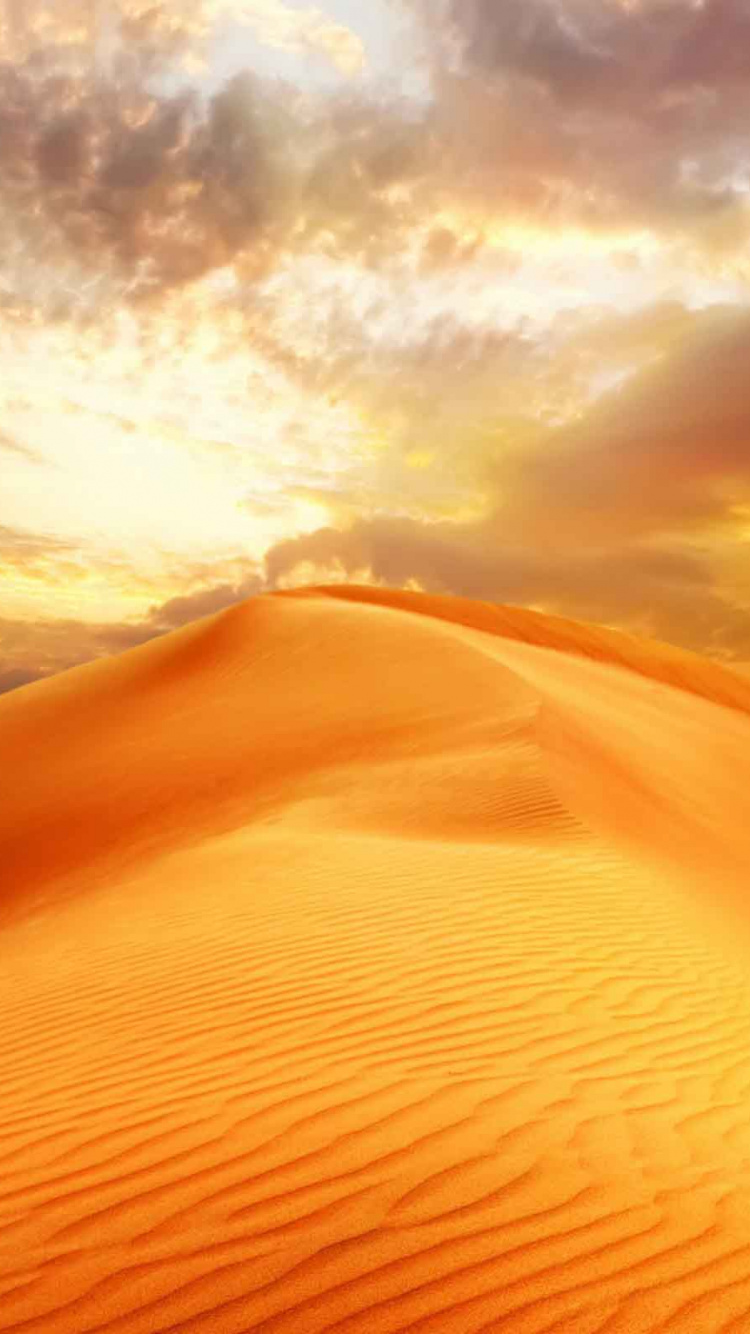 Brown Sand Under Cloudy Sky During Daytime. Wallpaper in 750x1334 Resolution