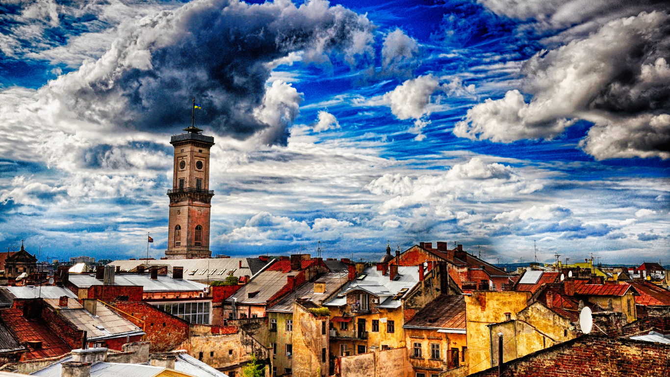 Edificio de Hormigón Marrón y Blanco Bajo un Cielo Azul y Nubes Blancas Durante el Día. Wallpaper in 1366x768 Resolution