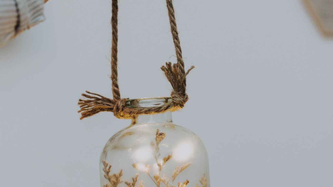 Person Holding Gold Colored Necklace. Wallpaper in 1366x768 Resolution