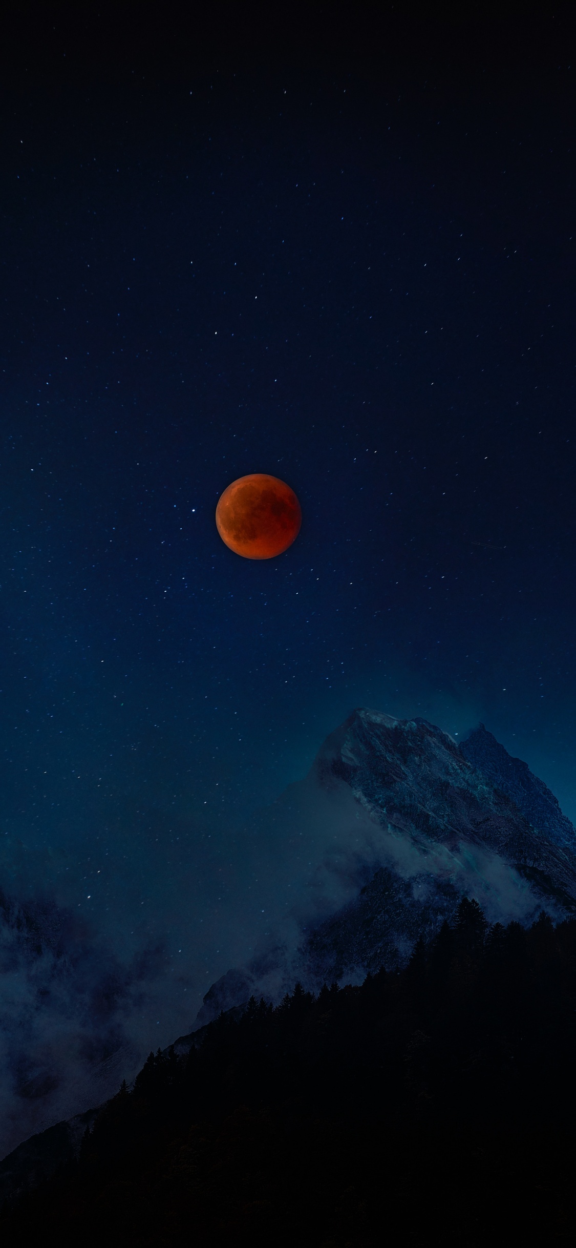 Silhouette of Mountain Under Blue Sky With Stars During Night Time. Wallpaper in 1125x2436 Resolution