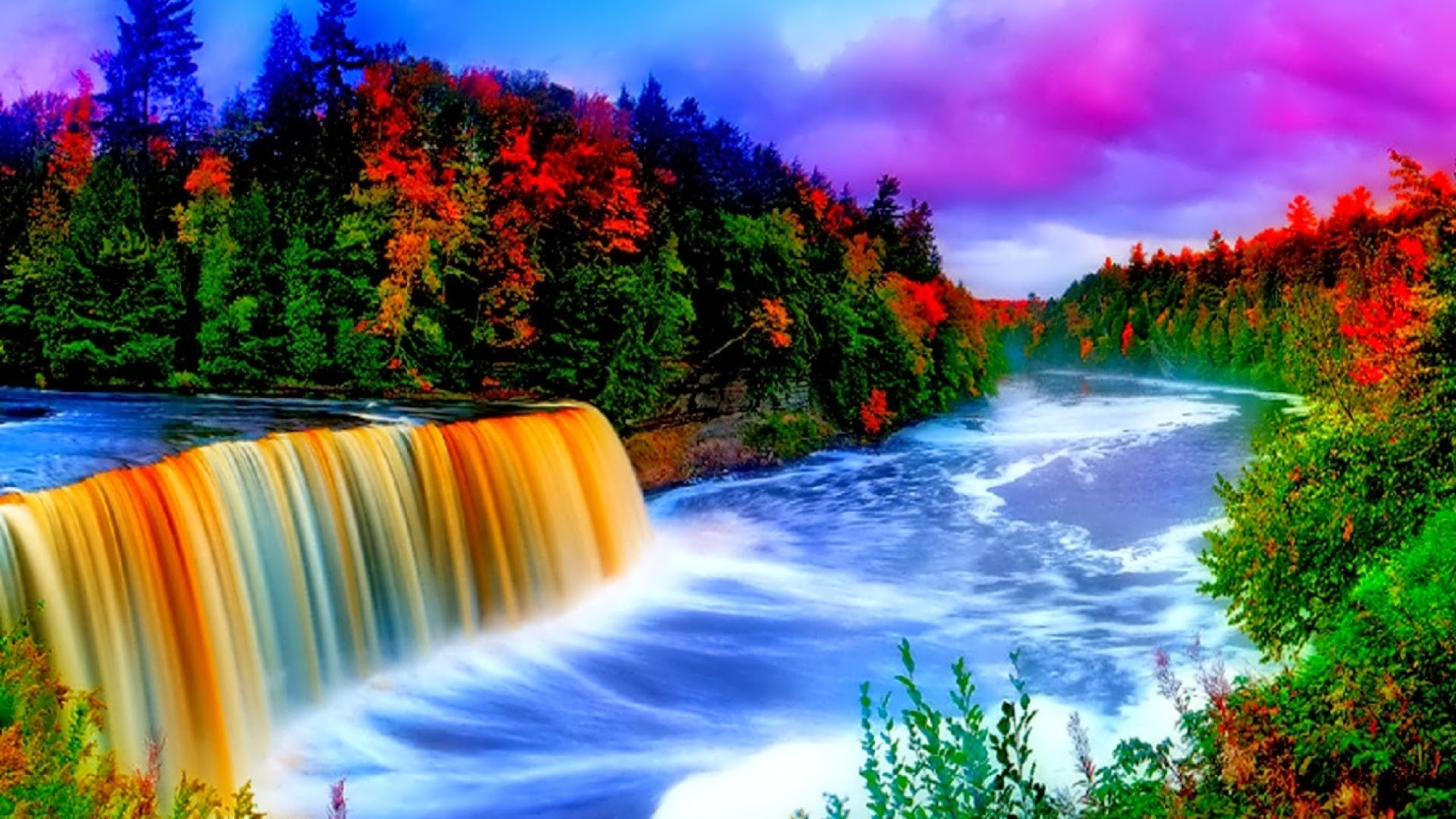 Water Falls Surrounded by Trees Under Blue Sky. Wallpaper in 2560x1440 Resolution