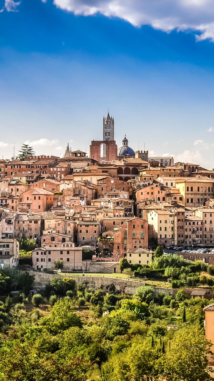Braune Und Weiße Betongebäude Unter Blauem Himmel Tagsüber. Wallpaper in 720x1280 Resolution