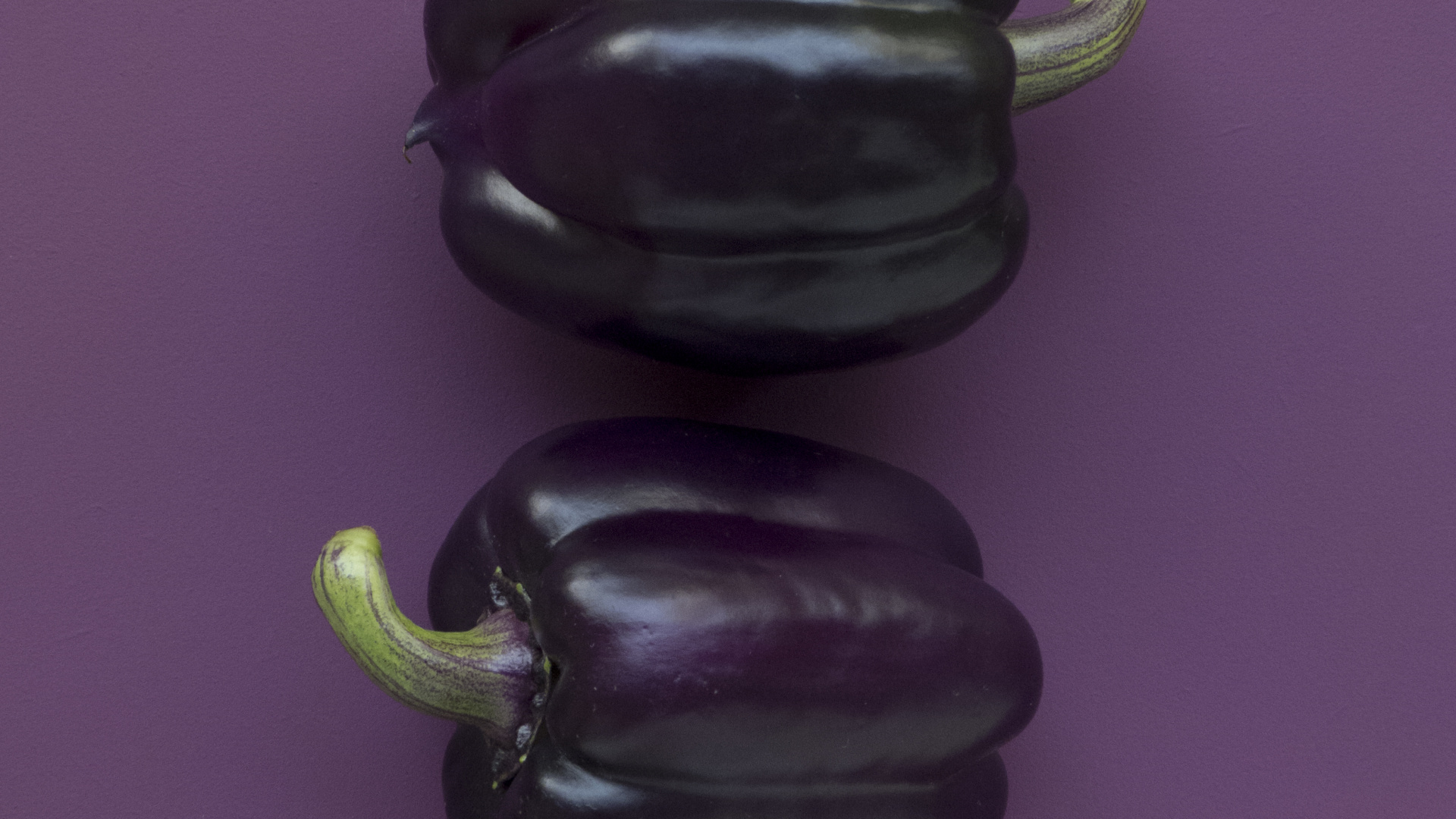 Black Bell Pepper on Purple Textile. Wallpaper in 1920x1080 Resolution