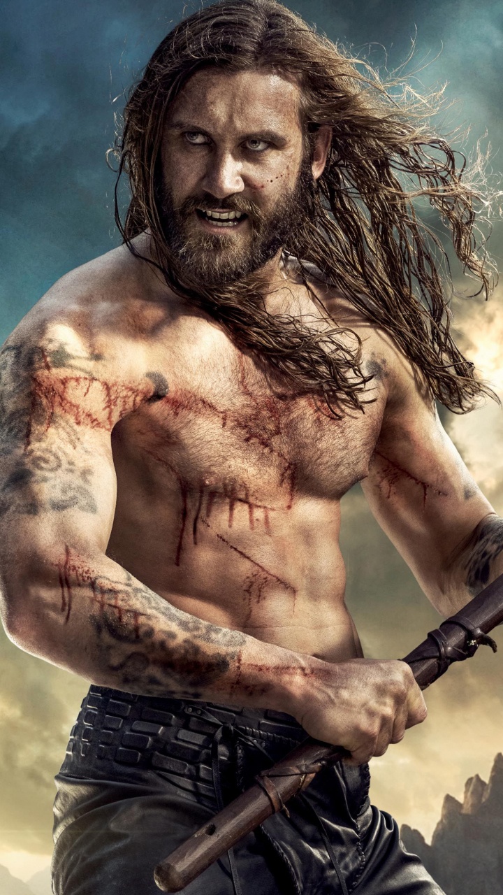 Topless Man Holding Black and Red Baseball Bat. Wallpaper in 720x1280 Resolution