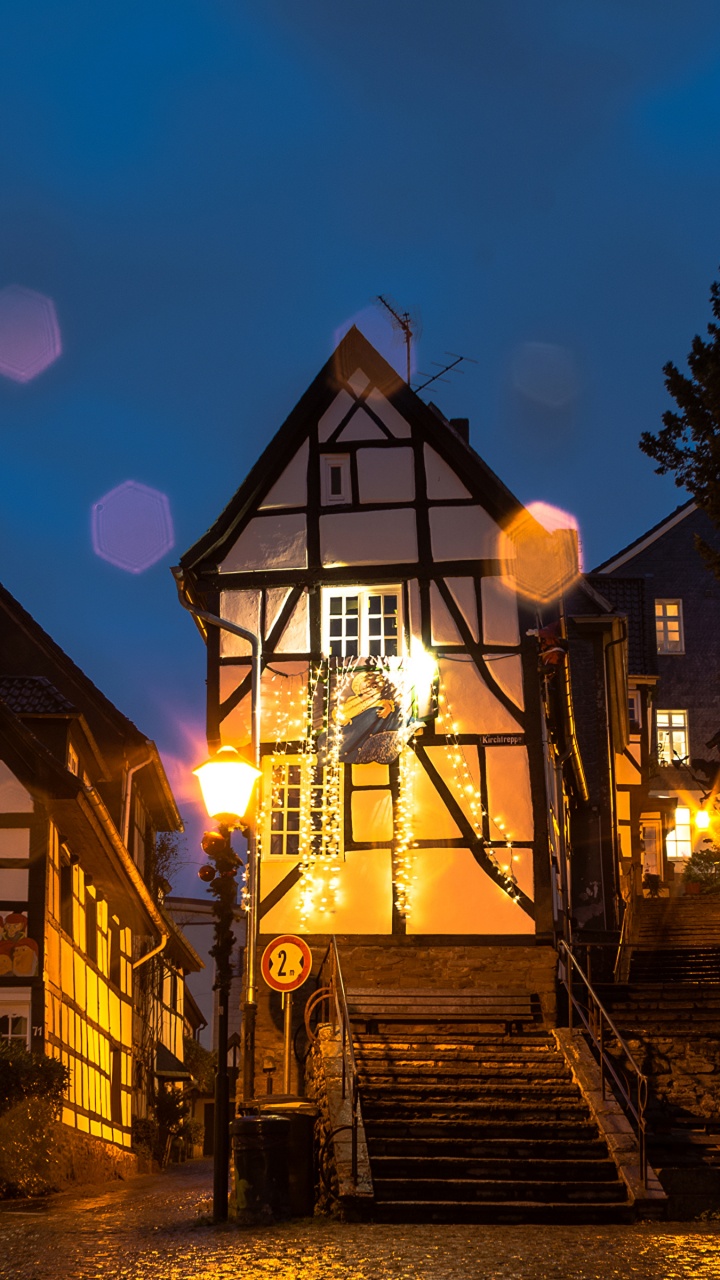 Brown Concrete Building During Night Time. Wallpaper in 720x1280 Resolution