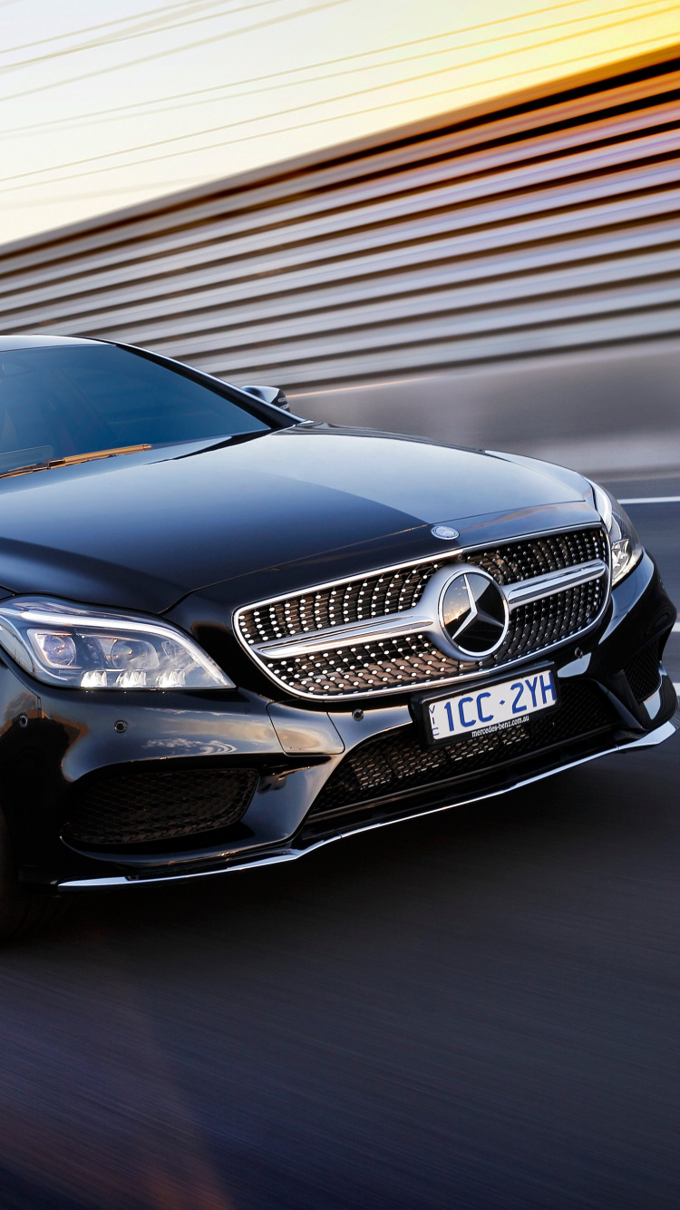 Brown Mercedes Benz Coupe on Road. Wallpaper in 750x1334 Resolution