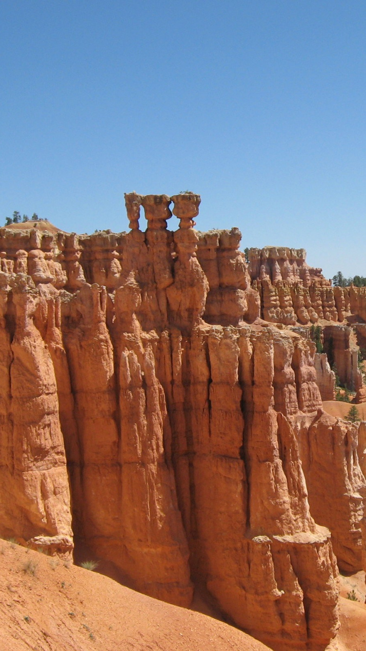 Brown Rock Formation Under Blue Sky During Daytime. Wallpaper in 750x1334 Resolution