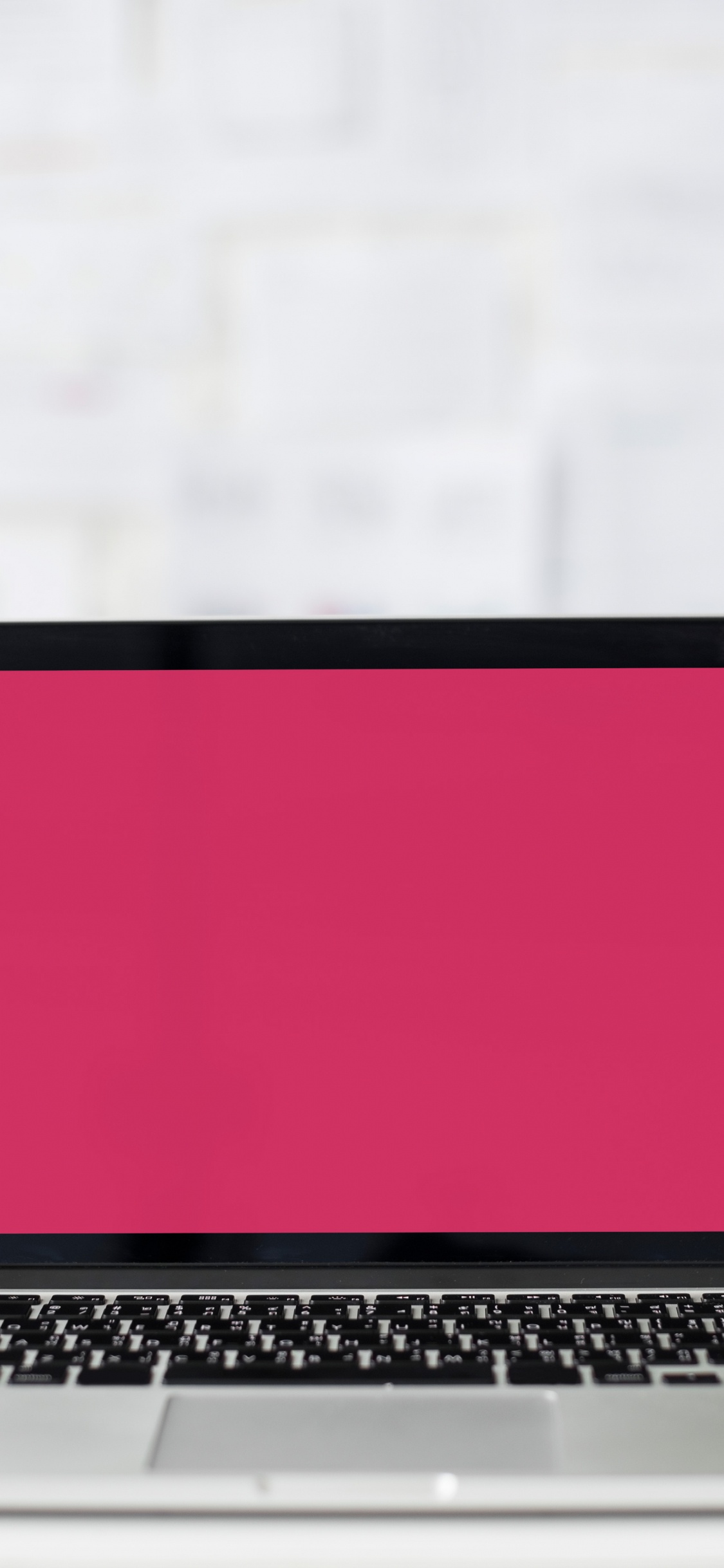 Macbook Pro on White Table. Wallpaper in 1125x2436 Resolution