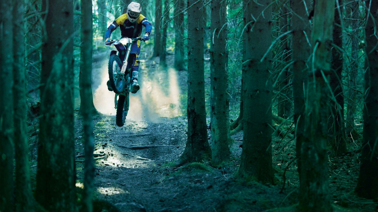 Man in Blue Jacket and Blue Helmet Riding on Blue Motocross Dirt Bike in The Woods. Wallpaper in 1280x720 Resolution