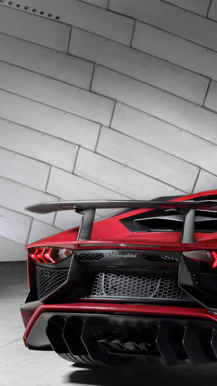 Red Ferrari 458 Italia Parked on Gray Pavement. Wallpaper in 750x1334 Resolution