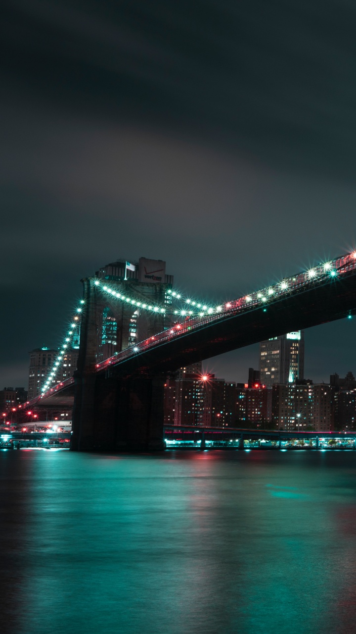 Bridge Over Water During Night Time. Wallpaper in 720x1280 Resolution