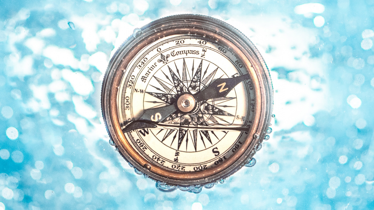 Silver and Black Compass on Blue and White Surface. Wallpaper in 1280x720 Resolution