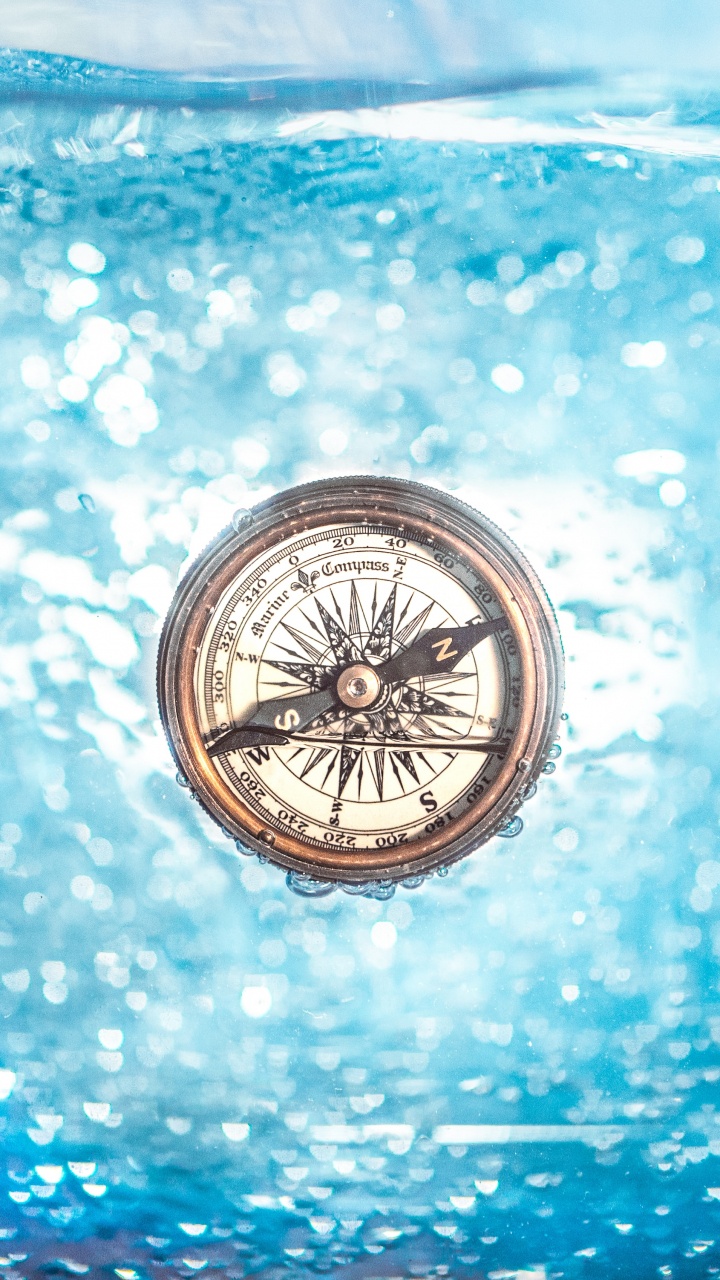 Silver and Black Compass on Blue and White Surface. Wallpaper in 720x1280 Resolution