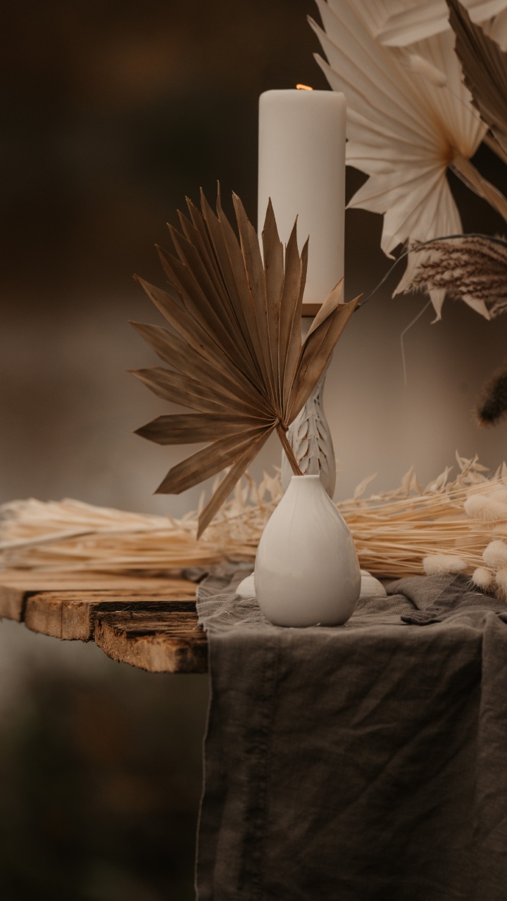 White Pillar Candle on Brown Wooden Table. Wallpaper in 720x1280 Resolution