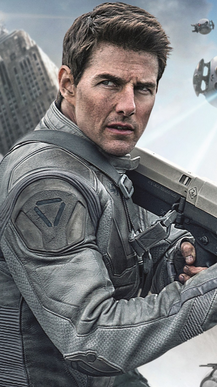 Man in Gray and Black Camouflage Jacket Holding White and Black Helicopter. Wallpaper in 750x1334 Resolution