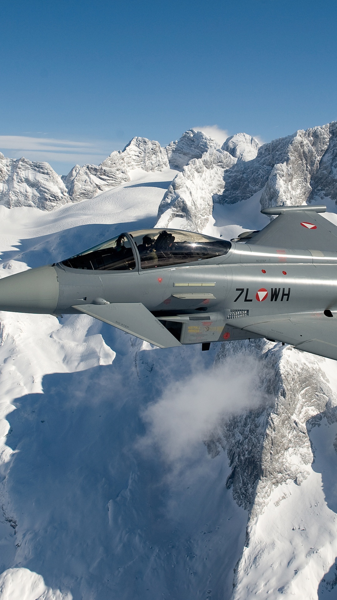 Gray Fighter Jet Flying Over Snow Covered Mountain During Daytime. Wallpaper in 1080x1920 Resolution