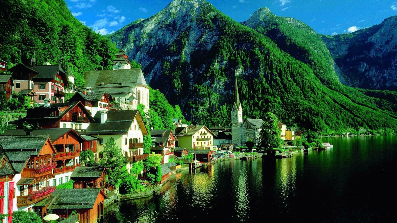 Houses Near Lake and Mountain During Daytime. Wallpaper in 1366x768 Resolution