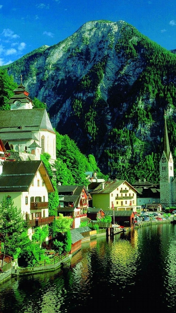 Houses Near Lake and Mountain During Daytime. Wallpaper in 720x1280 Resolution