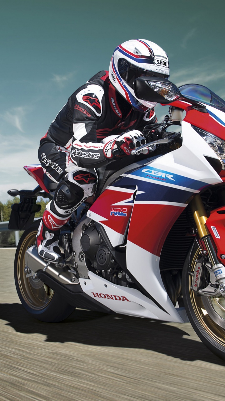 Man Riding on Red and White Sports Bike. Wallpaper in 720x1280 Resolution