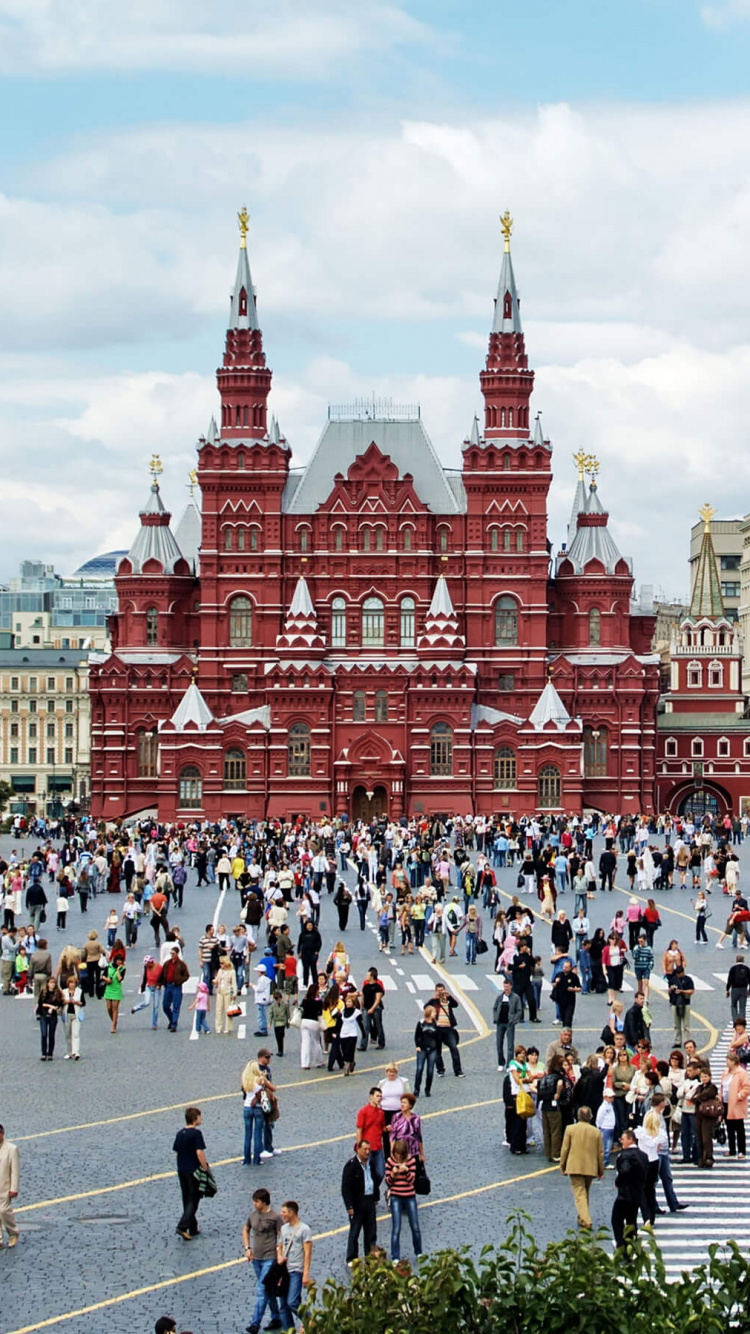 People Walking on Street Near Brown Concrete Building During Daytime. Wallpaper in 750x1334 Resolution