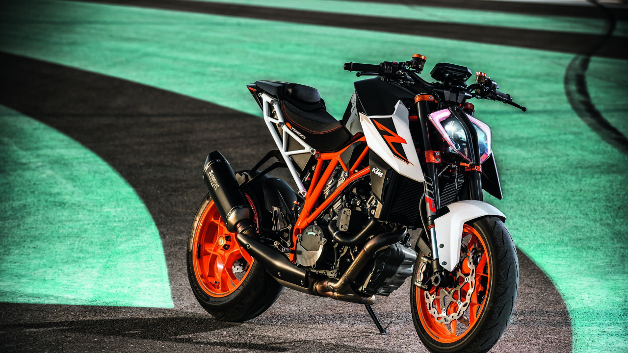 Orange and Black Sports Bike on Gray Concrete Road. Wallpaper in 1280x720 Resolution