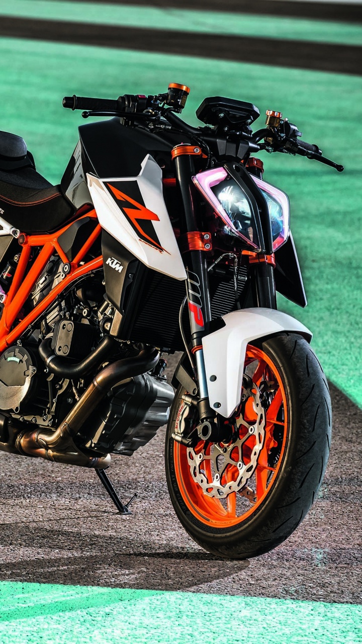 Orange and Black Sports Bike on Gray Concrete Road. Wallpaper in 720x1280 Resolution