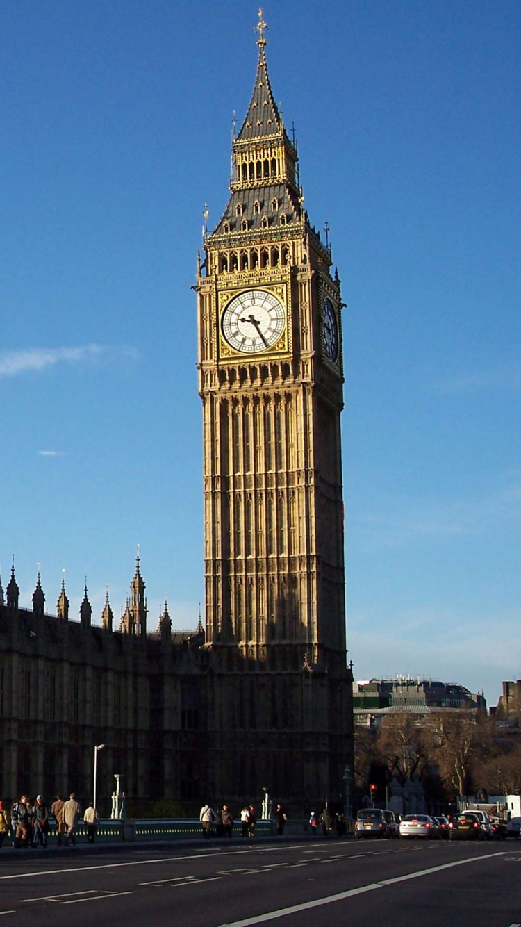 Brown Concrete Building Under Blue Sky During Daytime. Wallpaper in 750x1334 Resolution