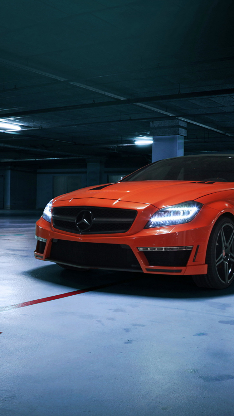 Naranja Bmw m 3 Coupe Estacionado en un Piso Blanco. Wallpaper in 750x1334 Resolution