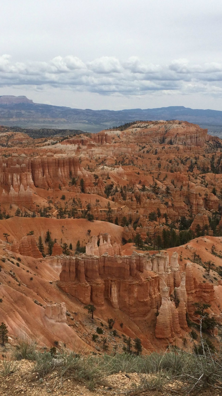 Brown Rock Formation Under White Clouds During Daytime. Wallpaper in 750x1334 Resolution