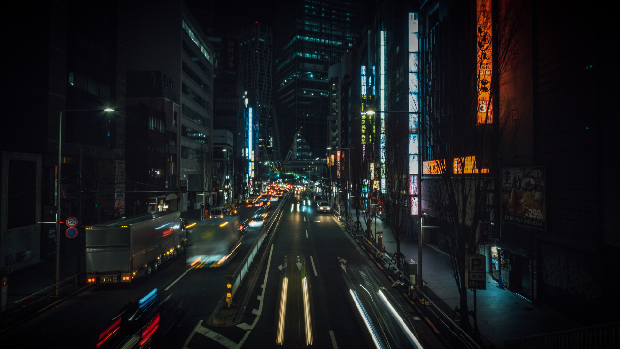 Cars on Road Between High Rise Buildings During Night Time. Wallpaper in 1280x720 Resolution