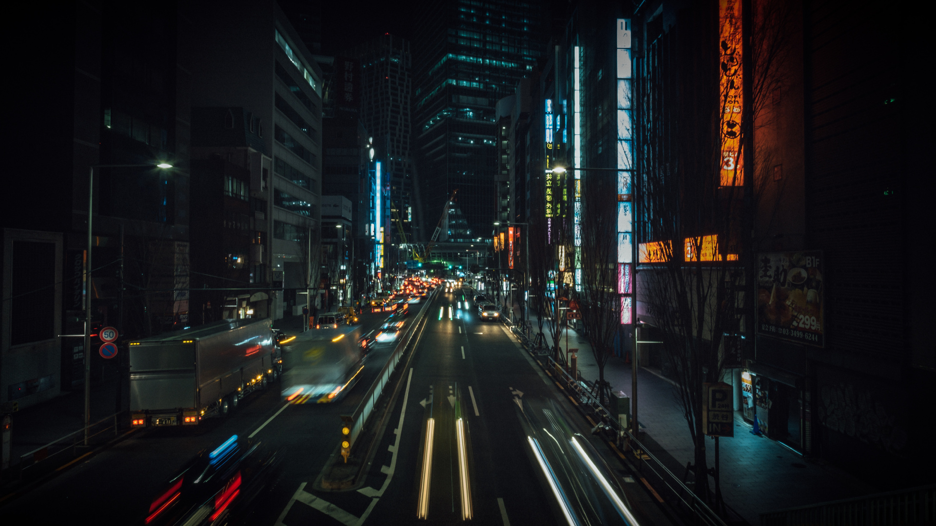 Cars on Road Between High Rise Buildings During Night Time. Wallpaper in 1920x1080 Resolution