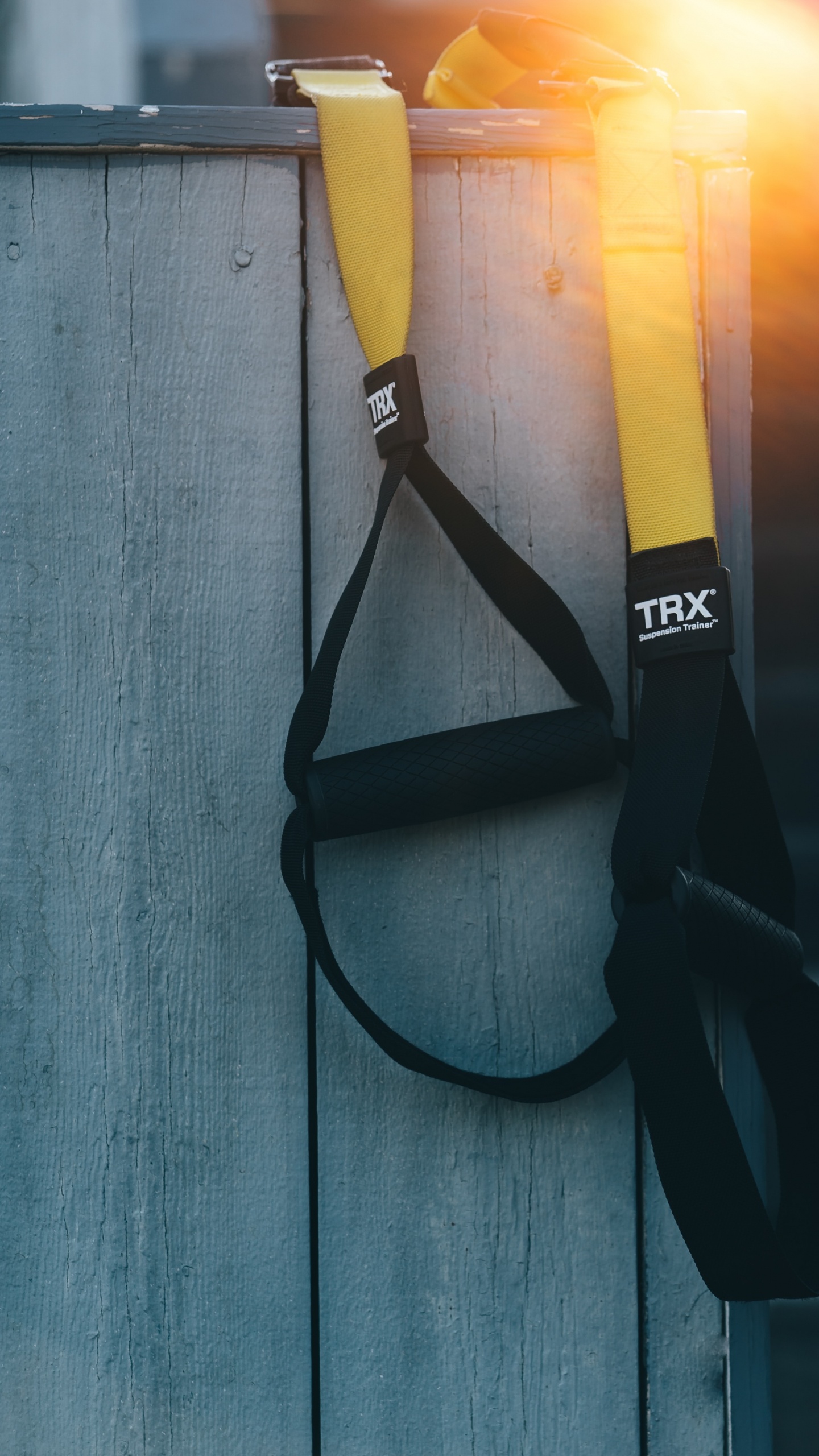 Black Strap on Blue Wooden Surface. Wallpaper in 1440x2560 Resolution