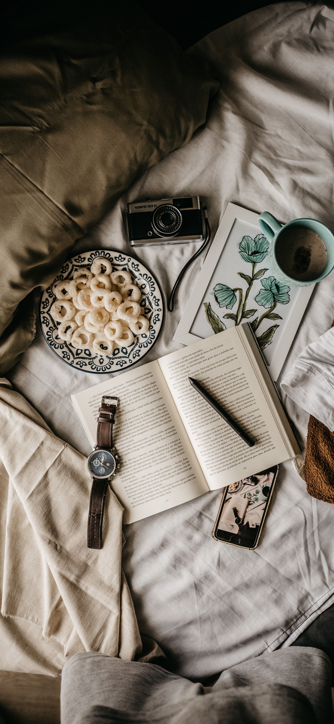 White Ceramic Mug on White Textile. Wallpaper in 1125x2436 Resolution