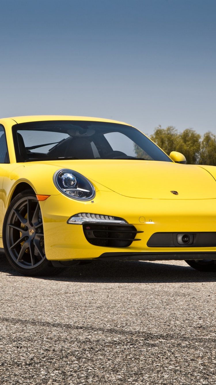 Yellow Porsche 911 on Grey Concrete Road During Daytime. Wallpaper in 750x1334 Resolution