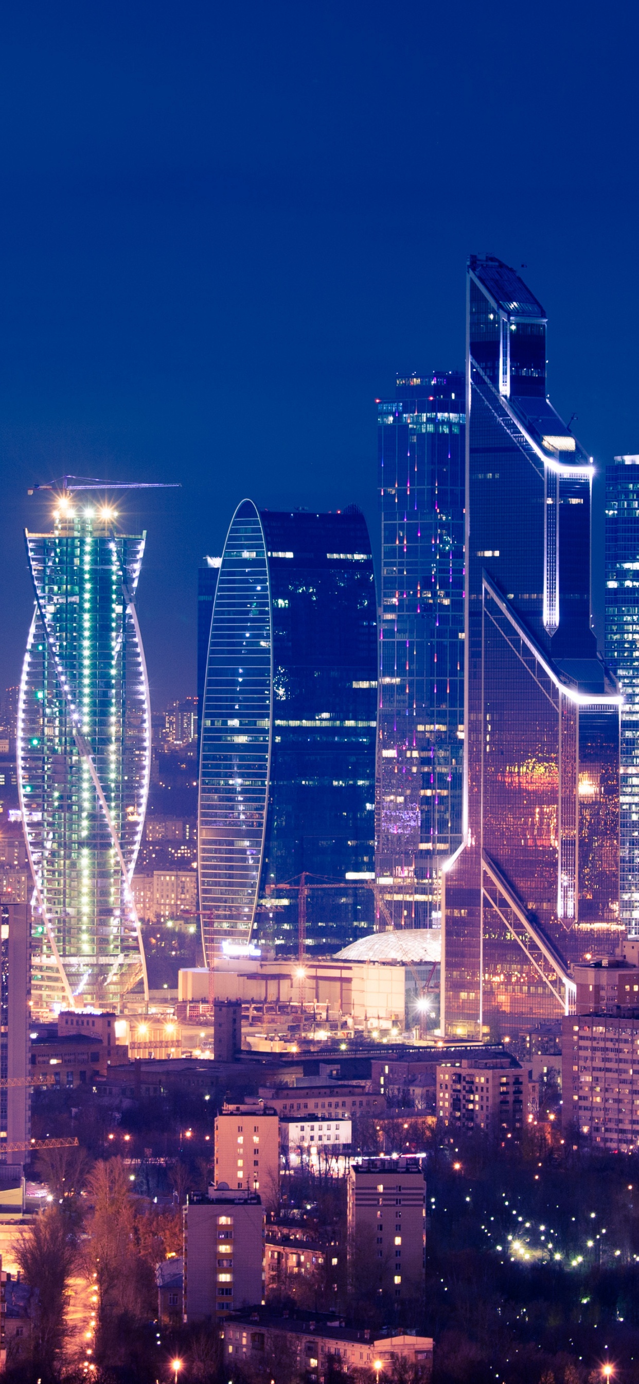 City Skyline During Night Time. Wallpaper in 1242x2688 Resolution