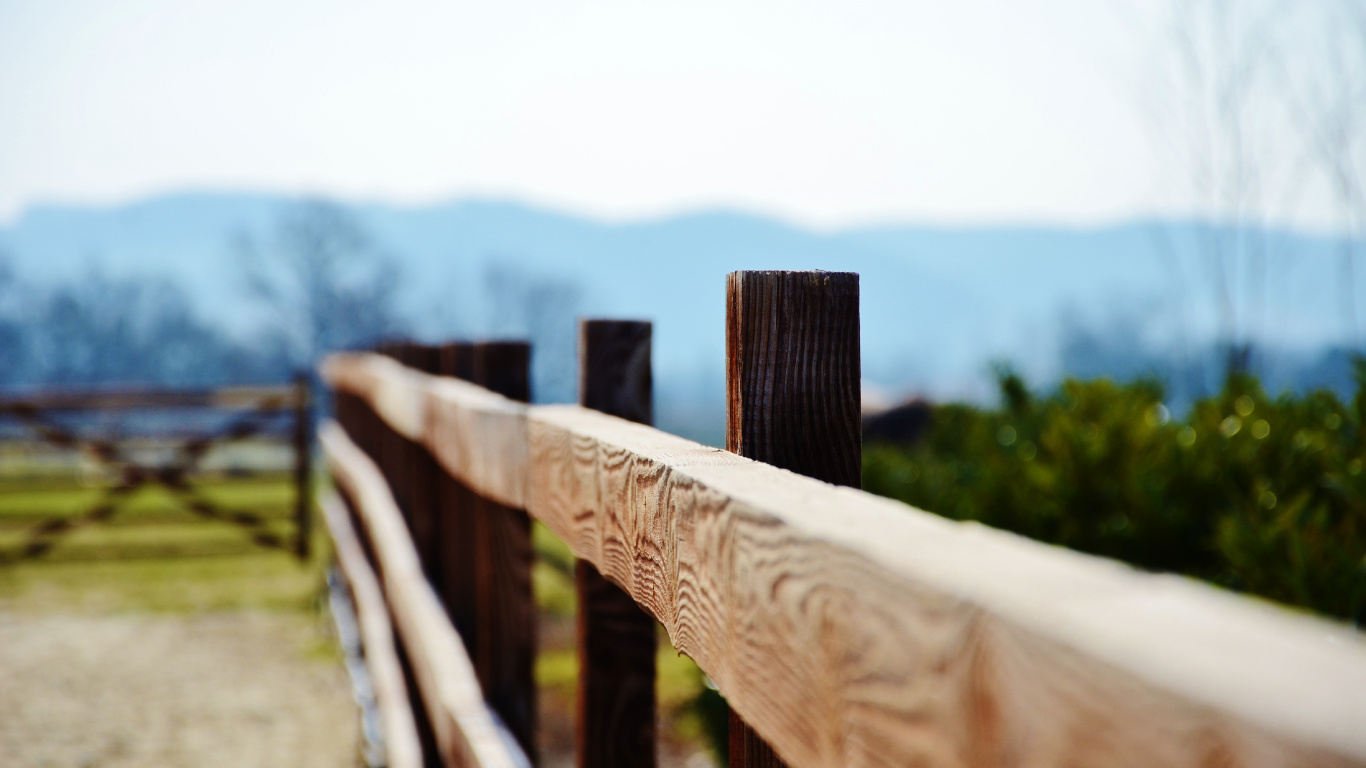 Brown Wooden Fence on Green Grass Field During Daytime. Wallpaper in 1366x768 Resolution