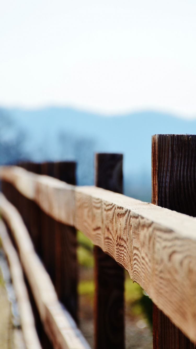 Brown Wooden Fence on Green Grass Field During Daytime. Wallpaper in 750x1334 Resolution