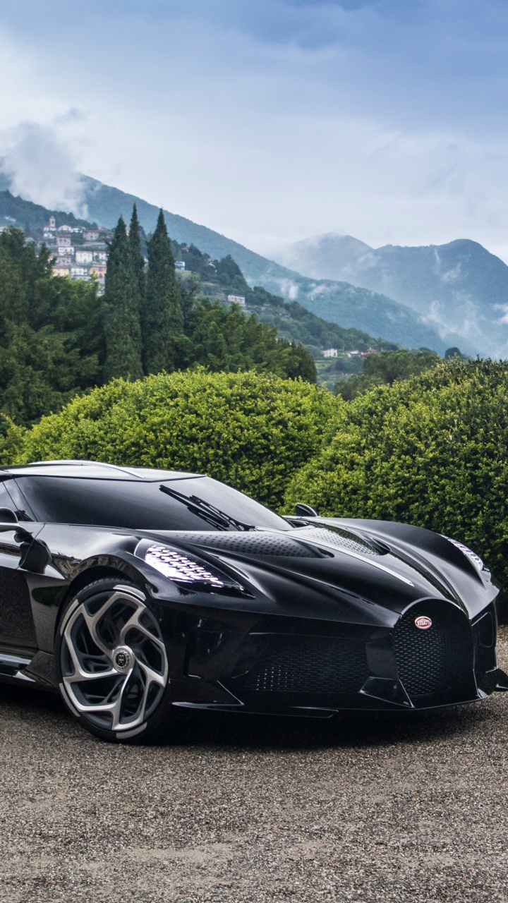 Black Porsche 911 on Road Near Green Trees and Mountains During Daytime. Wallpaper in 720x1280 Resolution