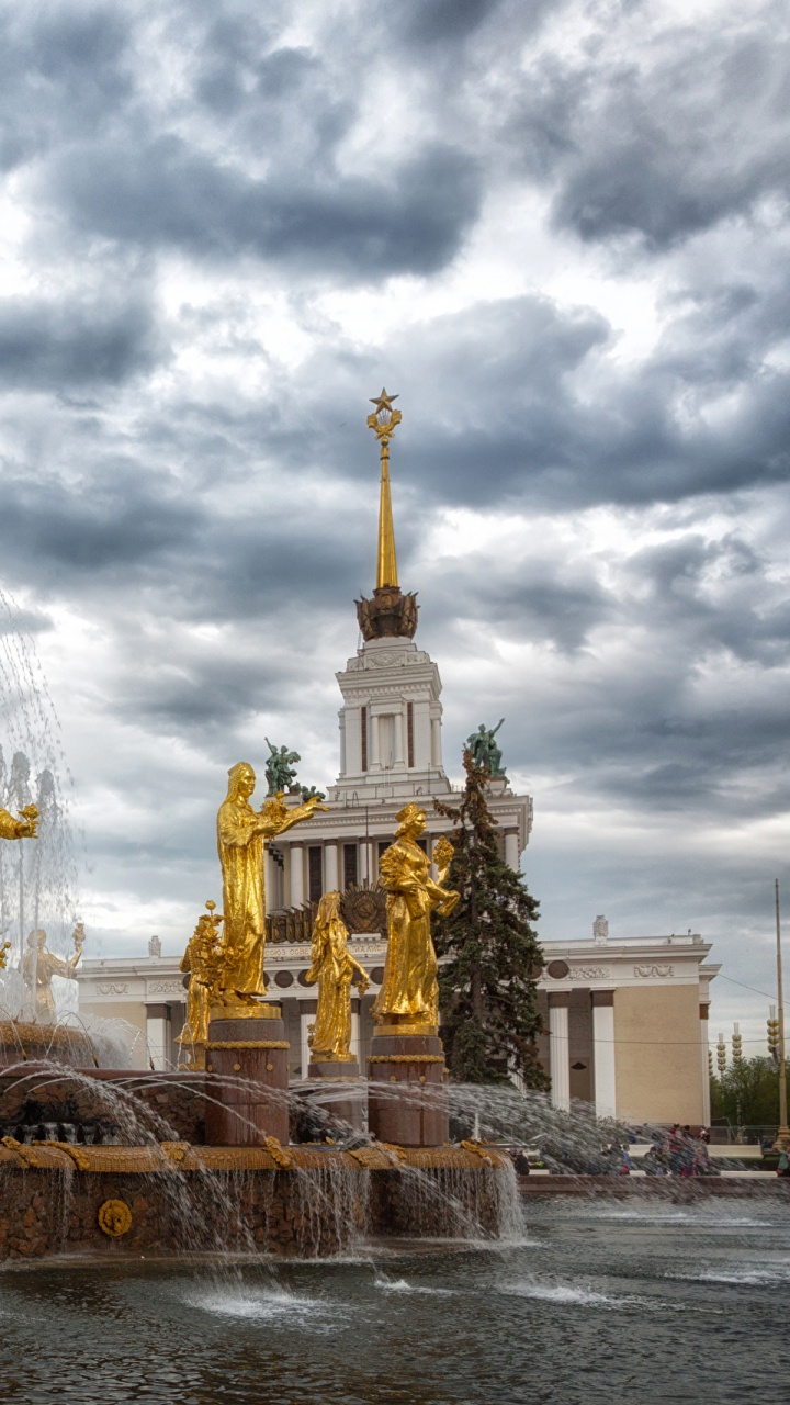 Gold Statue Under Cloudy Sky During Daytime. Wallpaper in 720x1280 Resolution