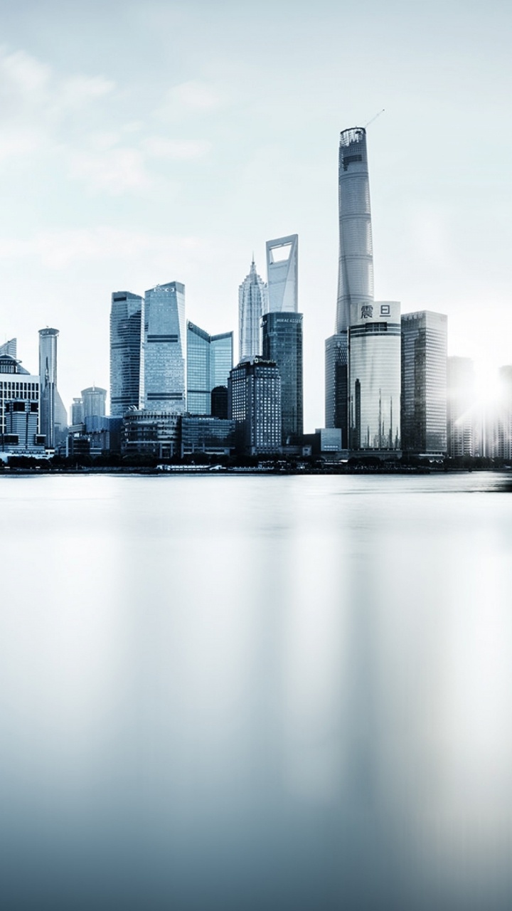 City Skyline Under White Sky During Daytime. Wallpaper in 720x1280 Resolution