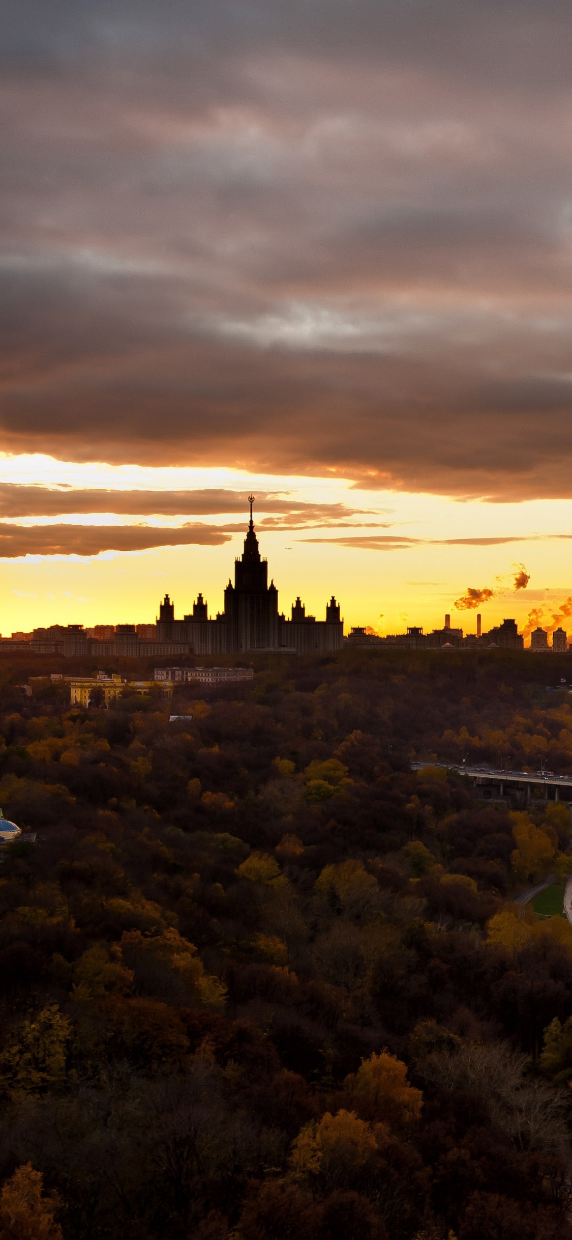 Aerial View of City During Sunset. Wallpaper in 1125x2436 Resolution