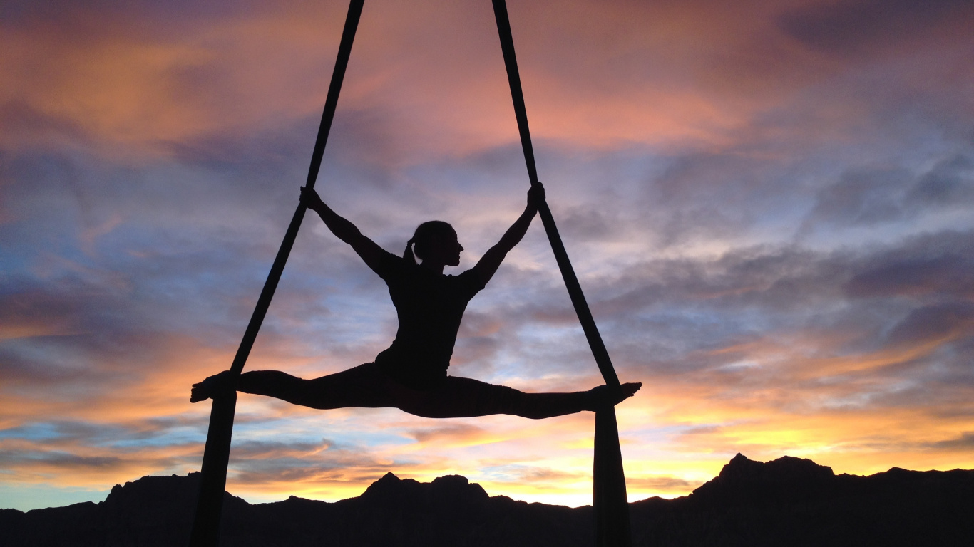 Silhouette of Man Sitting on Swing During Sunset. Wallpaper in 1366x768 Resolution