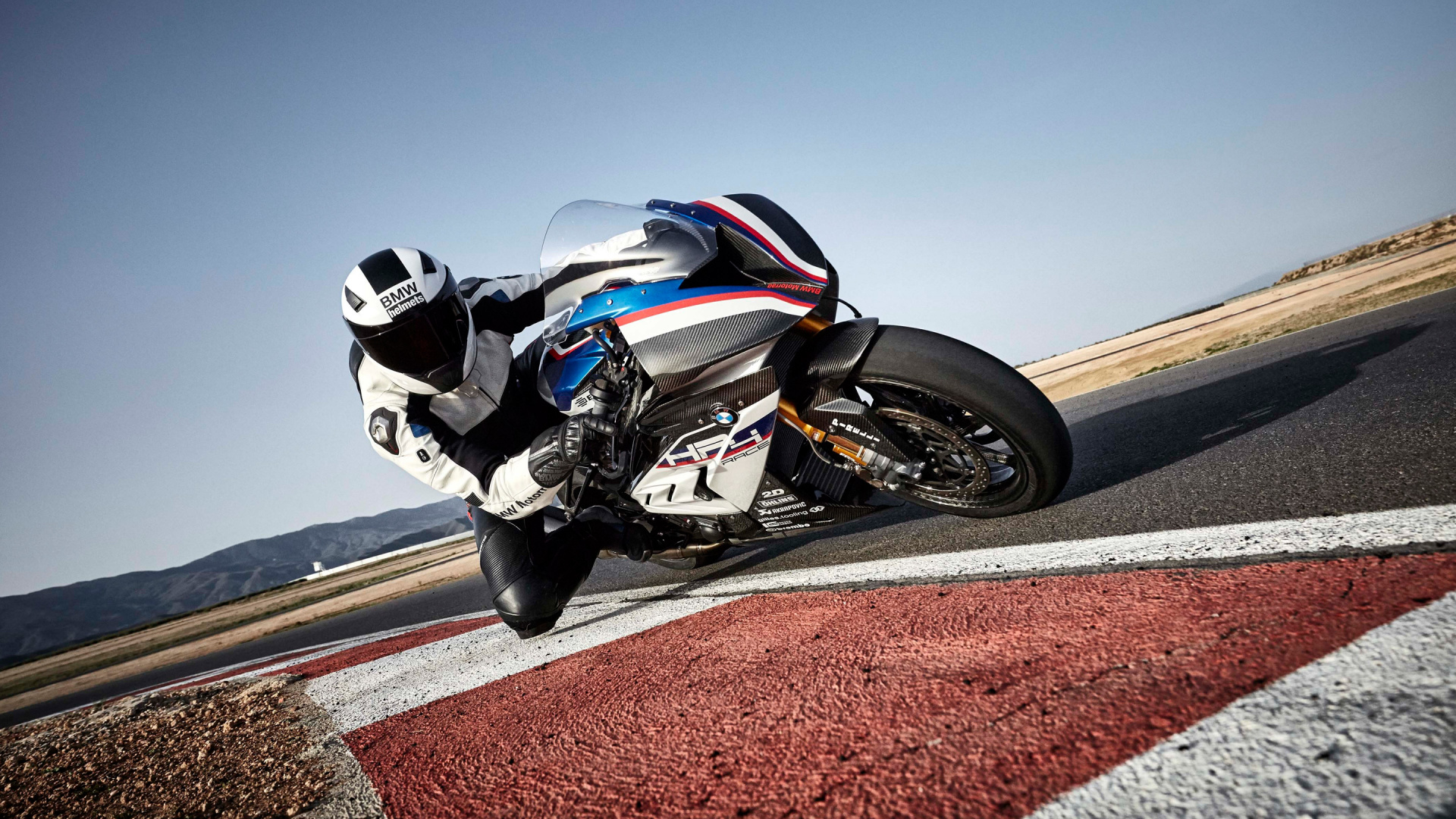 Man in Black and White Motorcycle Helmet Riding on Black Sports Bike on Road During Daytime. Wallpaper in 1920x1080 Resolution