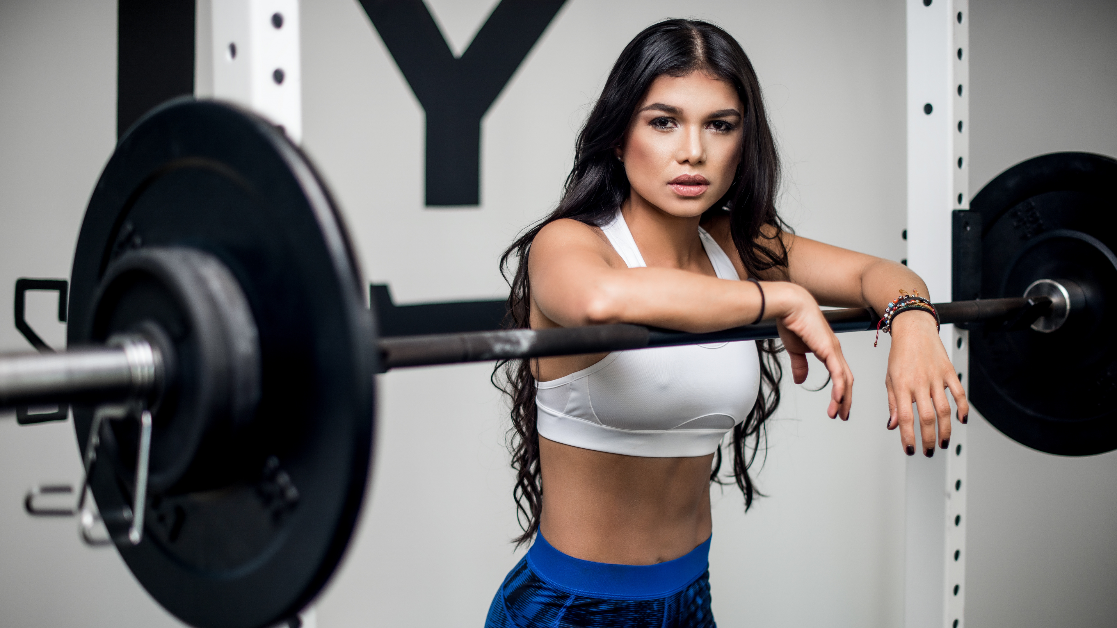 Woman in Blue Denim Shorts Holding Black Dumbbell. Wallpaper in 3840x2160 Resolution