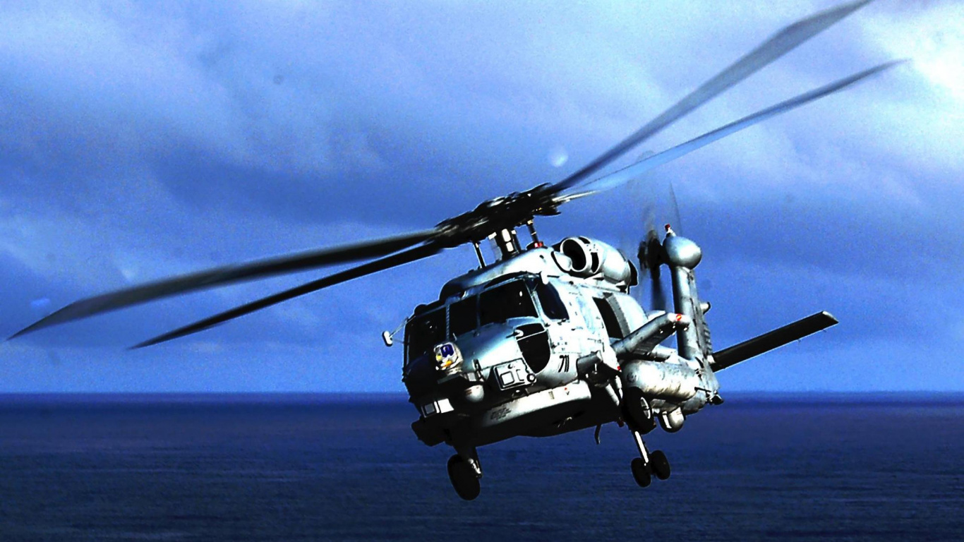 Helicóptero Negro Volando Sobre Las Nubes Durante el Día. Wallpaper in 1366x768 Resolution