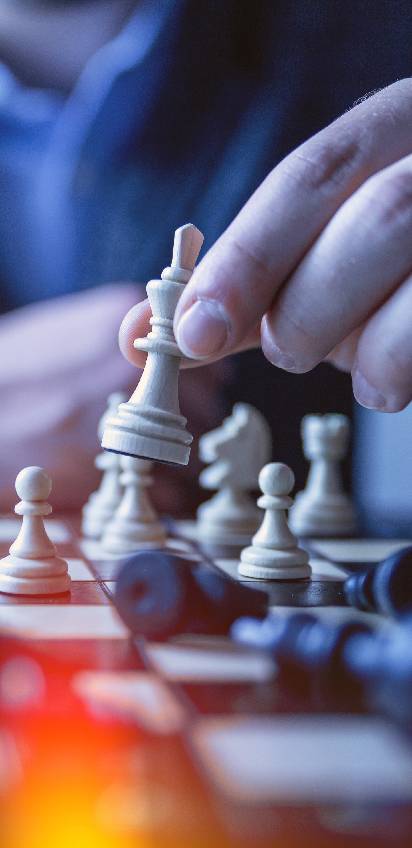 Person Holding Chess Piece in Tilt Shift Lens. Wallpaper in 1440x2960 Resolution